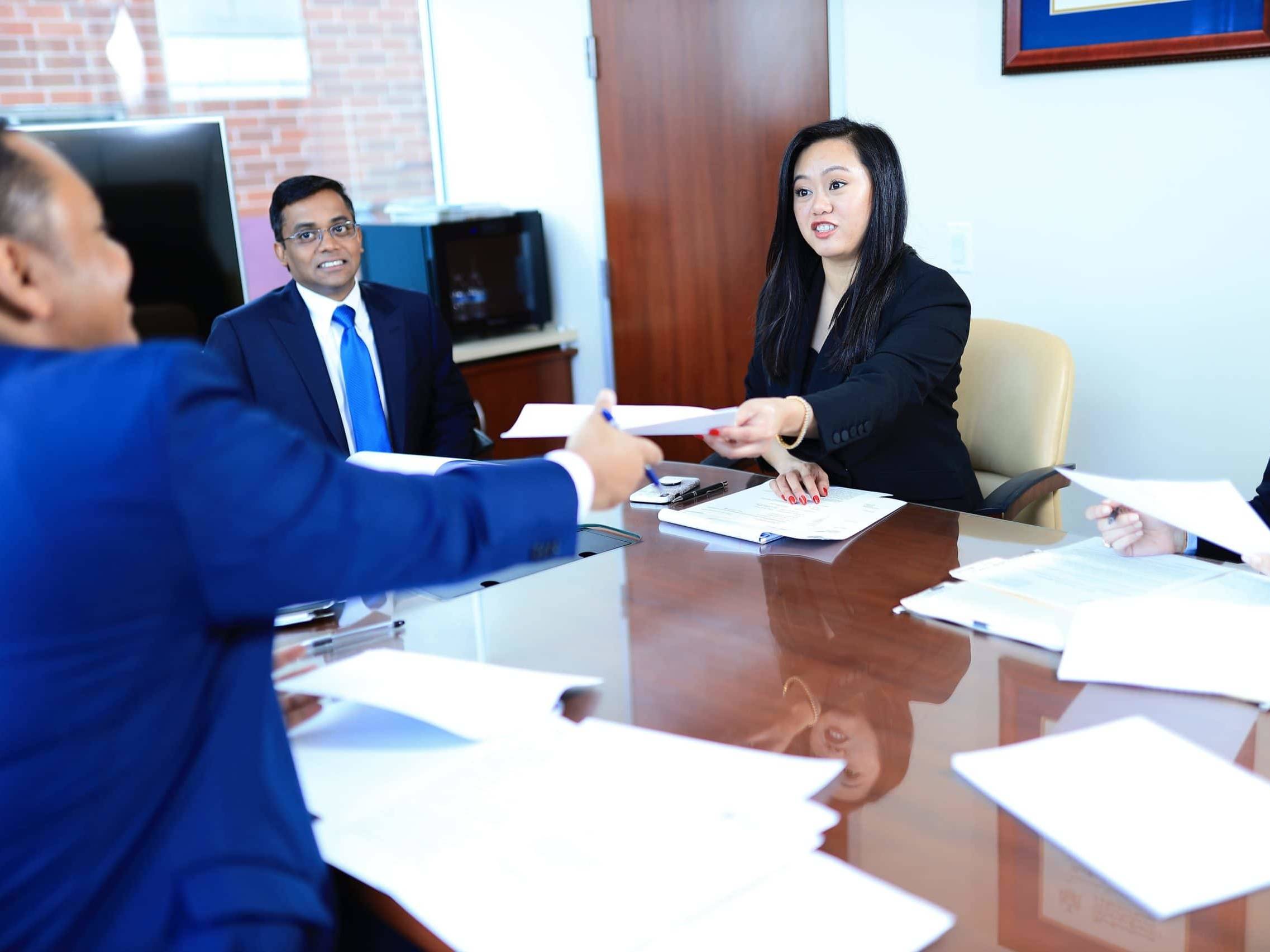 a lawyer passing a document