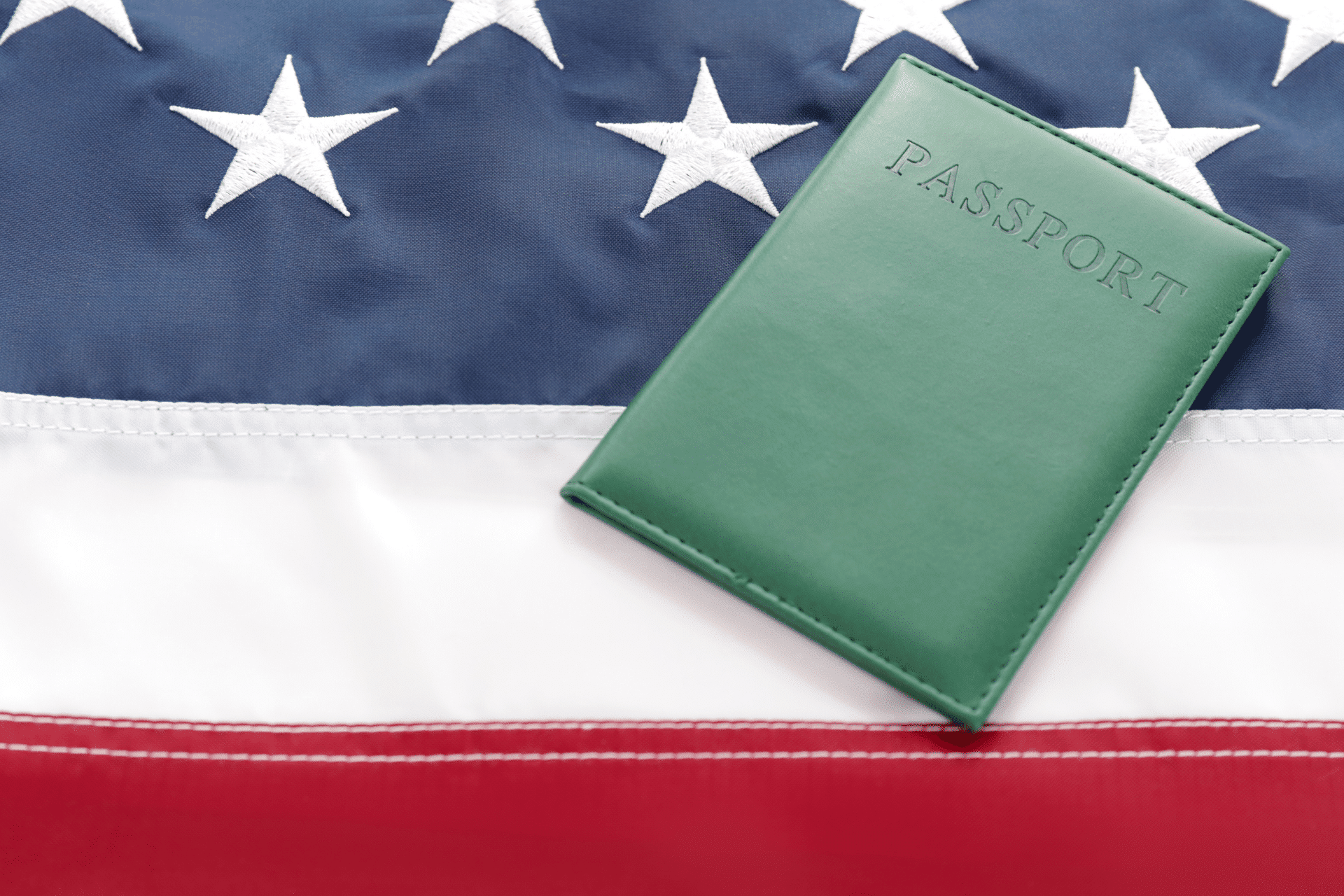 passport holder placed on the US flag