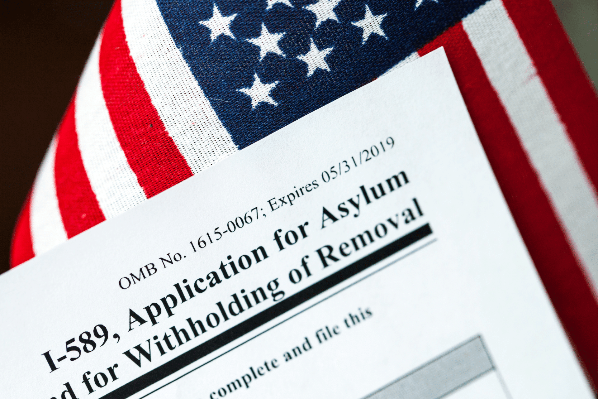 asylum application on top of a U.S. flag