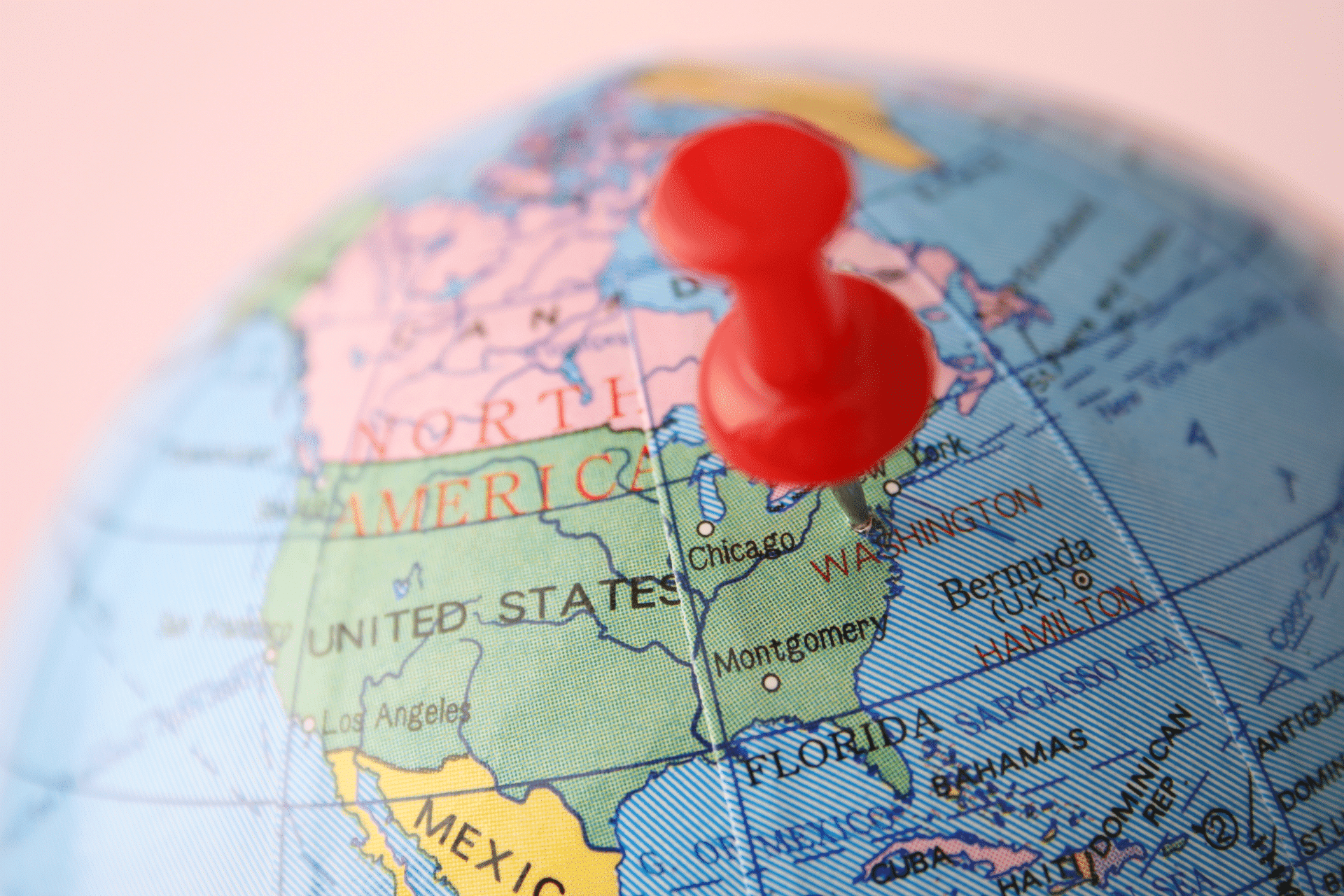 globe with a pin in the united states