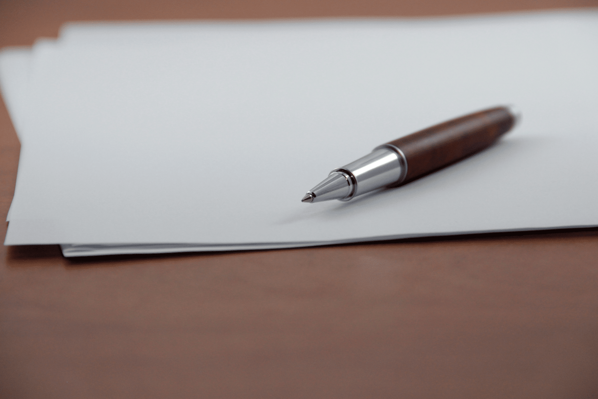 pen on paper on a desk