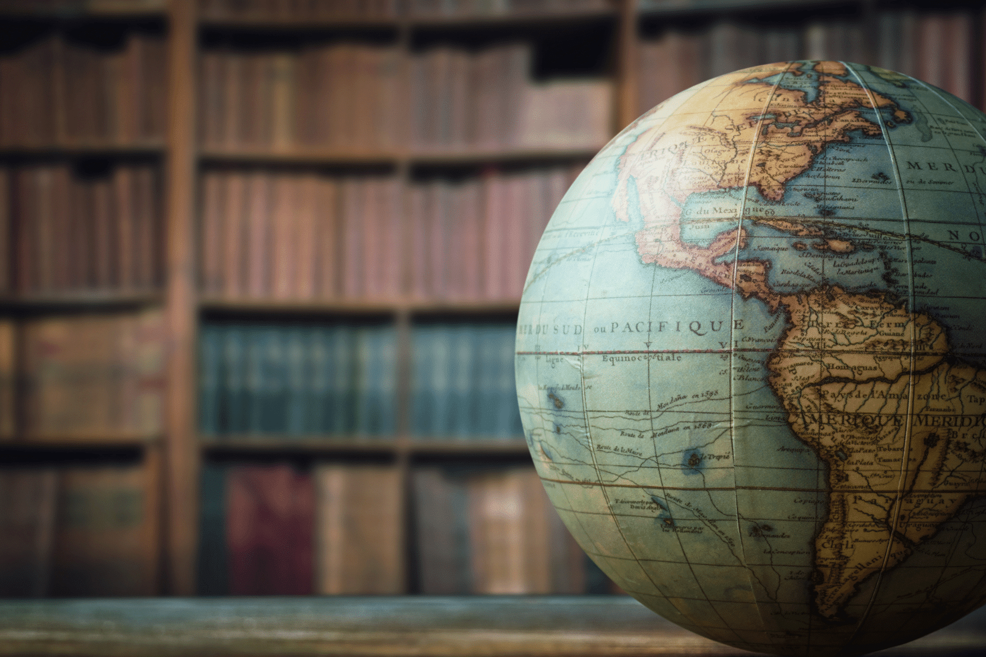 globe of the world on a table in a library