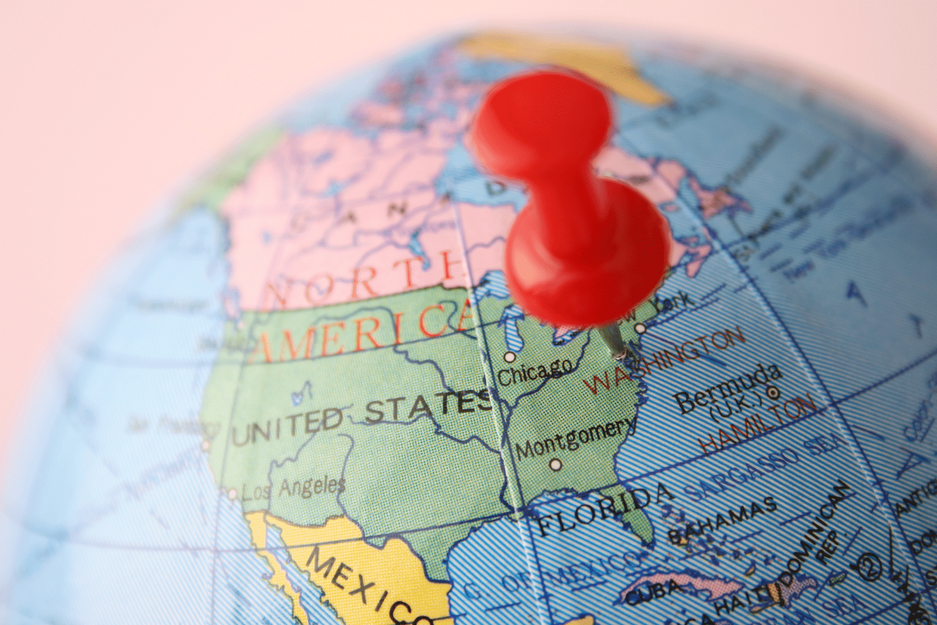 globe of the world with a pin in the United States