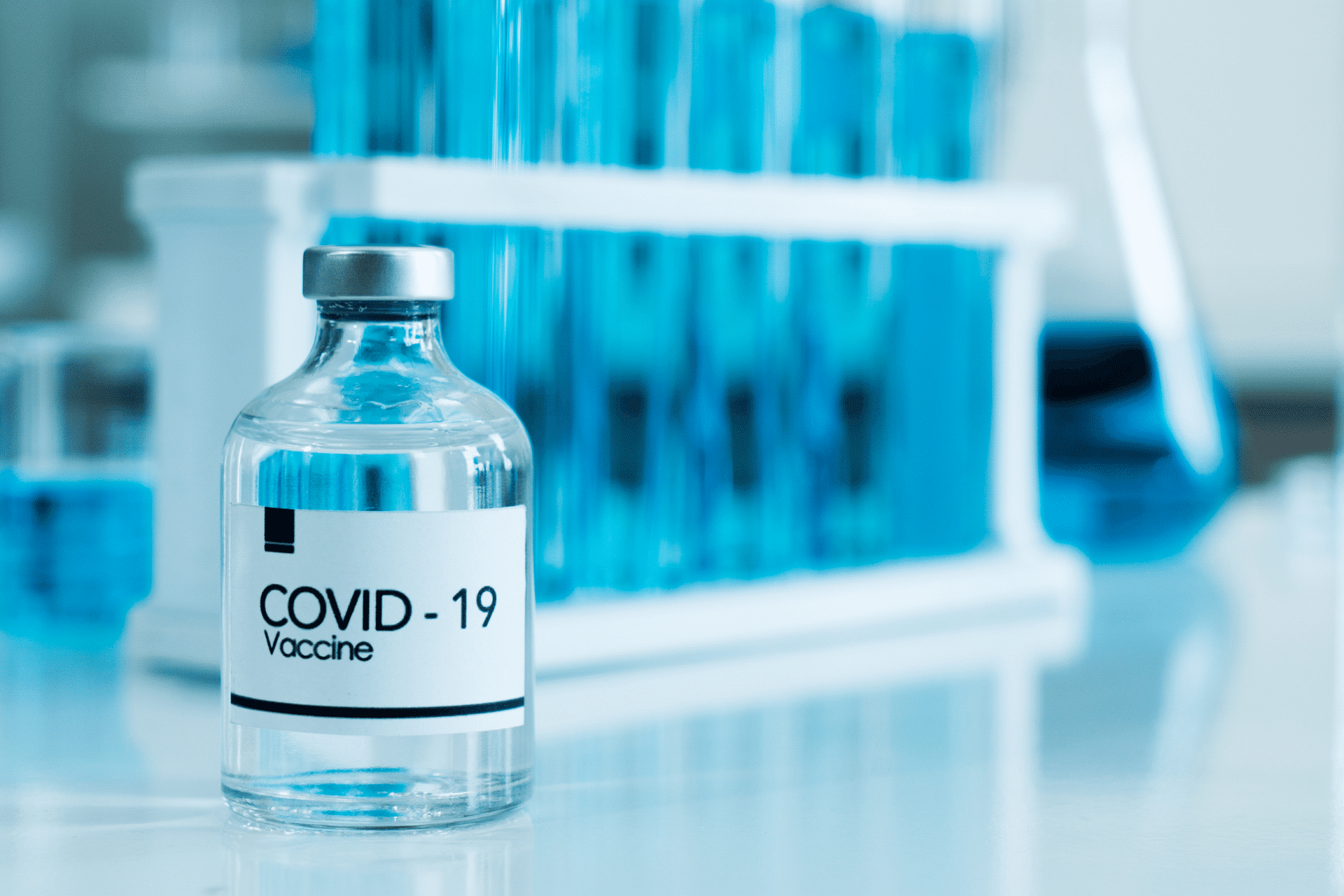bottle of COVID vaccine on a table