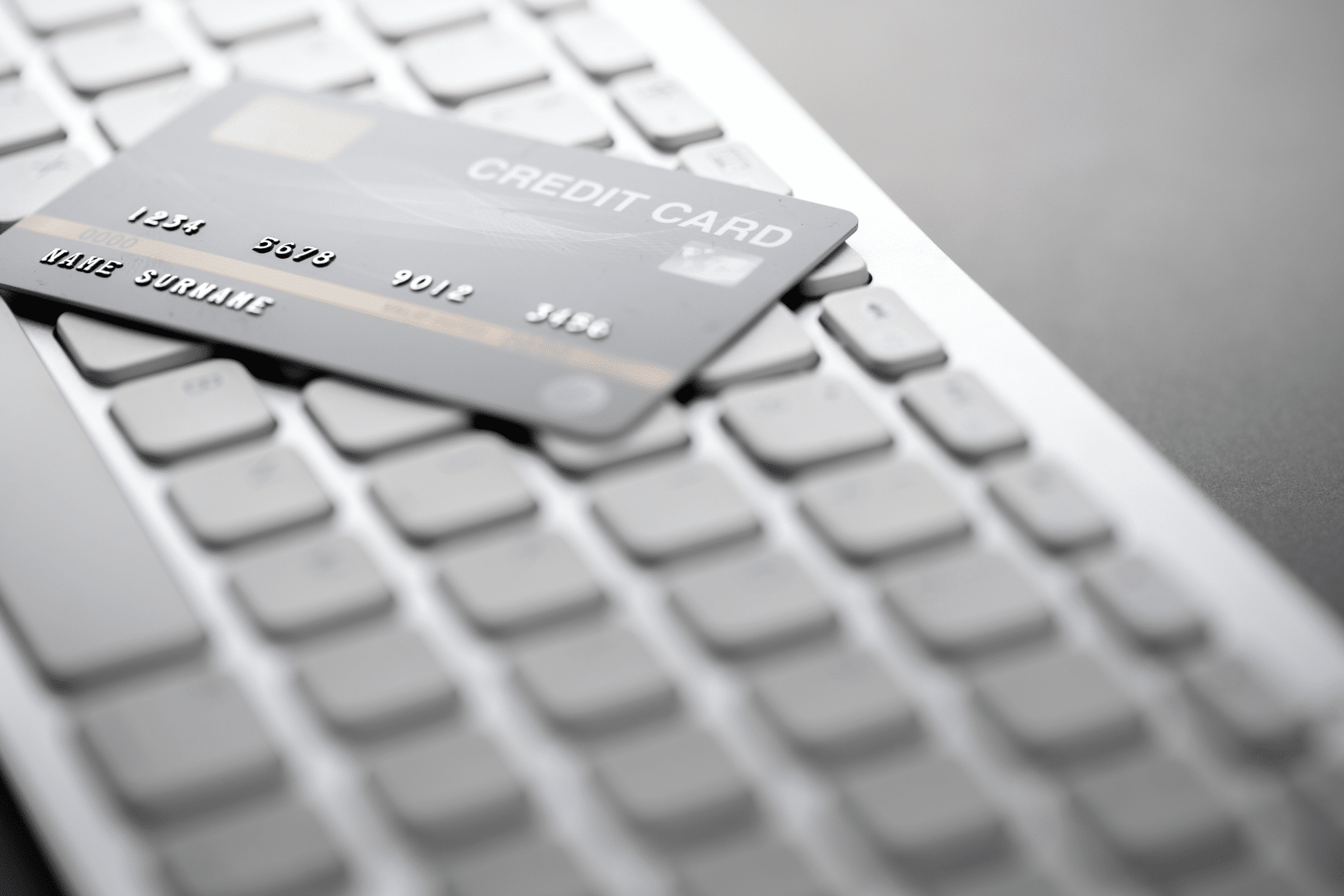 blank credit card on a keyboard